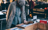 person standing in front of brown crate